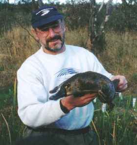 APC’s Geoff Williams about to release one of the platypus trapped in the 2001 survey of Campbells Creek. Photo by Kim Brownless, 12th Apr 2001